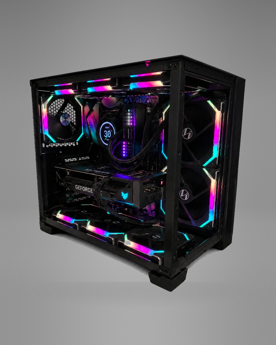 Three-quarter view of Blackprism 004 from the other side, glass front and side panels lit by spectrum fans.