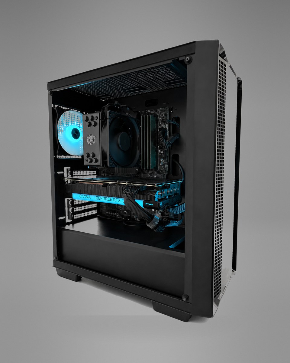 Front three-quarter view of Midnight Circuit 001 with the side panel open, showing the tower cooler, memory modules, graphics card and blue-lit fans.