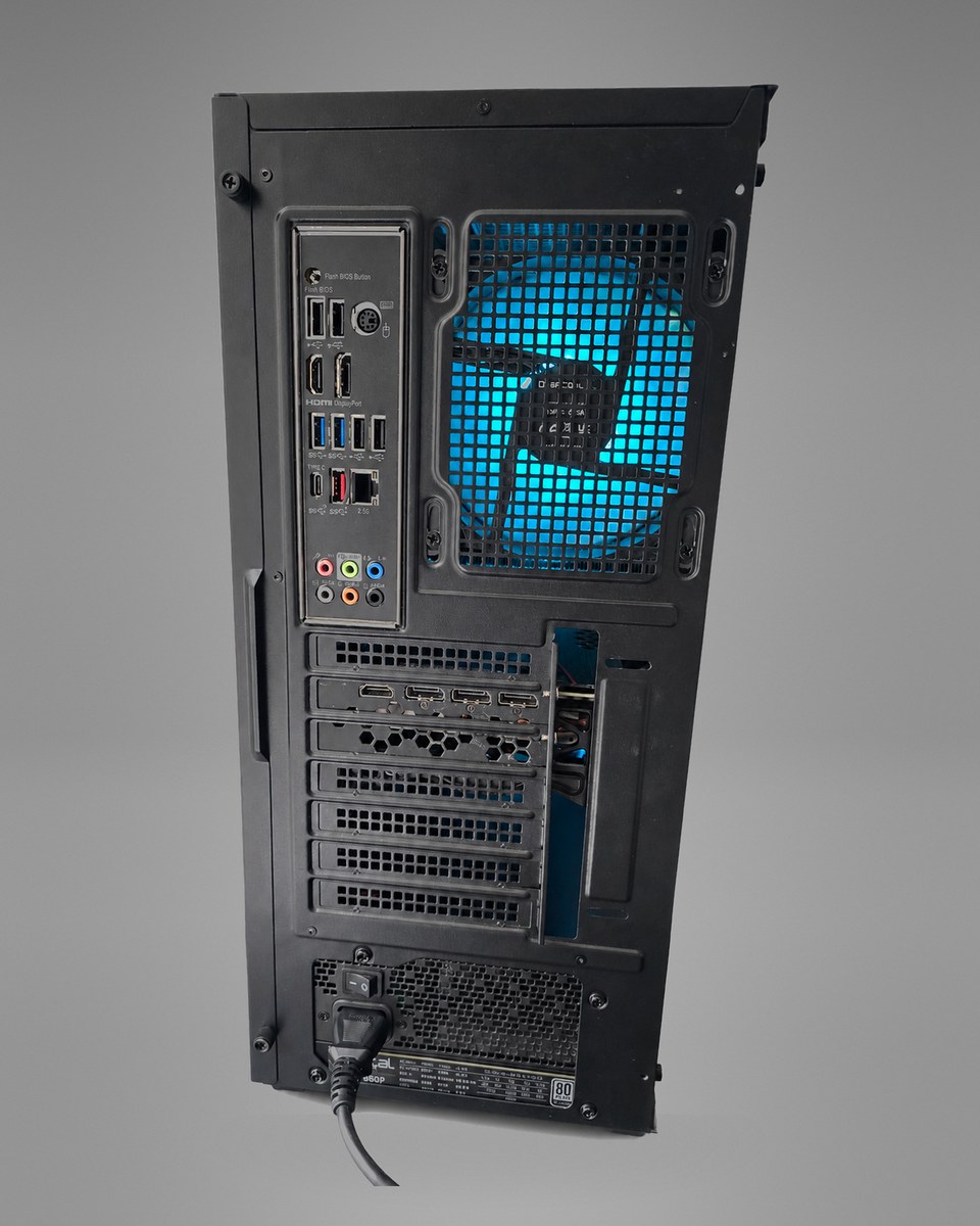 Straight rear view of Midnight Circuit 001 showing the motherboard ports, graphics-card outputs, rear fan and power supply.