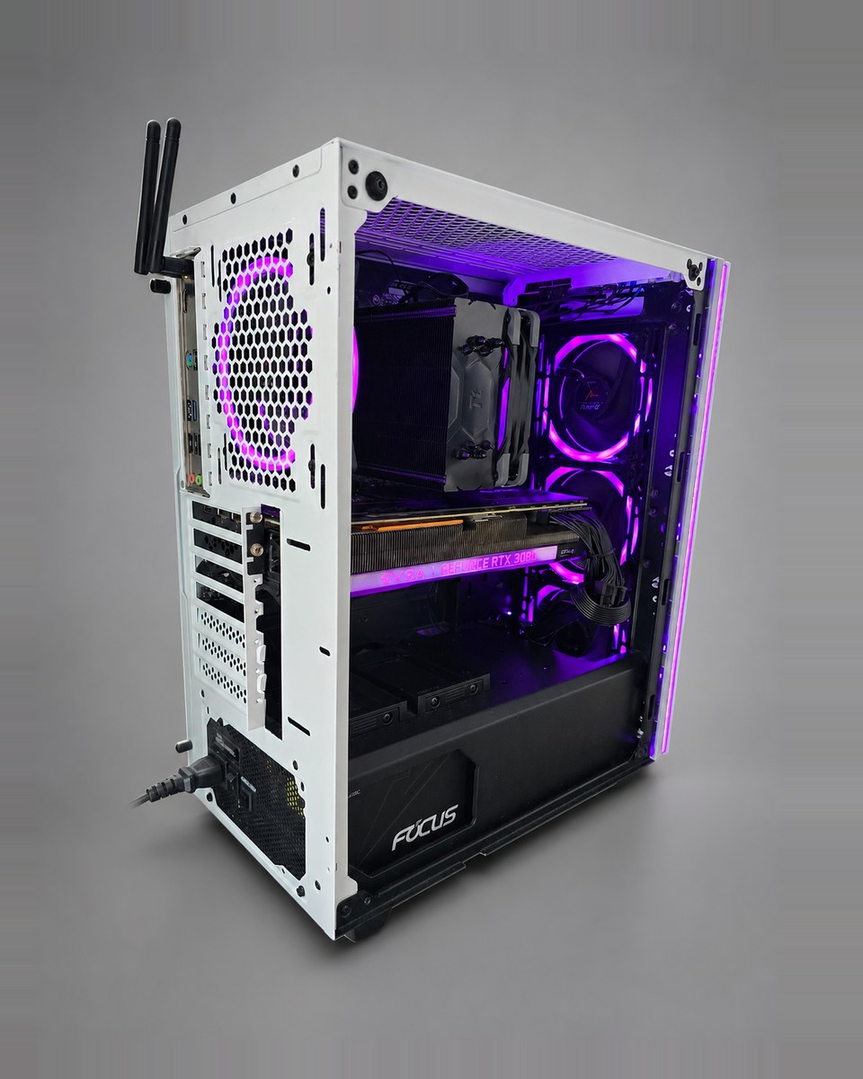 Rear three-quarter view of Snowlight 002 under purple lighting, showing the interior, the rear fan and the power supply.