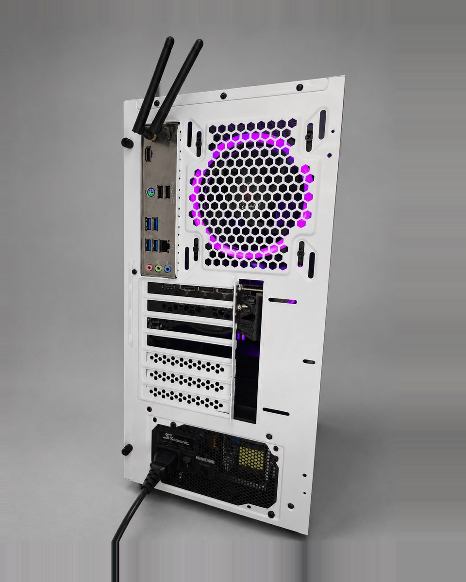 Angled rear view of Snowlight 002 showing the white chassis, the magenta-lit rear fan behind its honeycomb grille and the connected power cable.